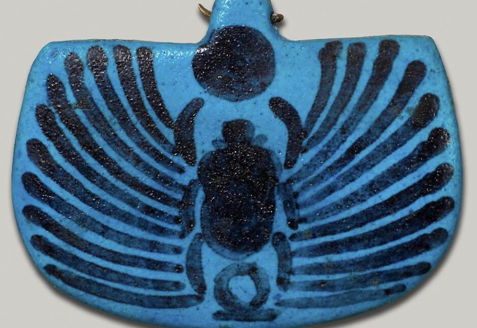 Blue and black glaze pendant with a sun disc and a shen sign winged scarab