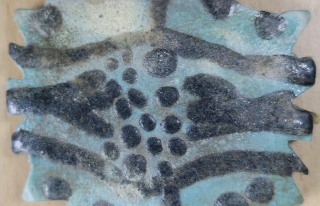 Blue/black glaze partly broken quadruple Wedjat eye