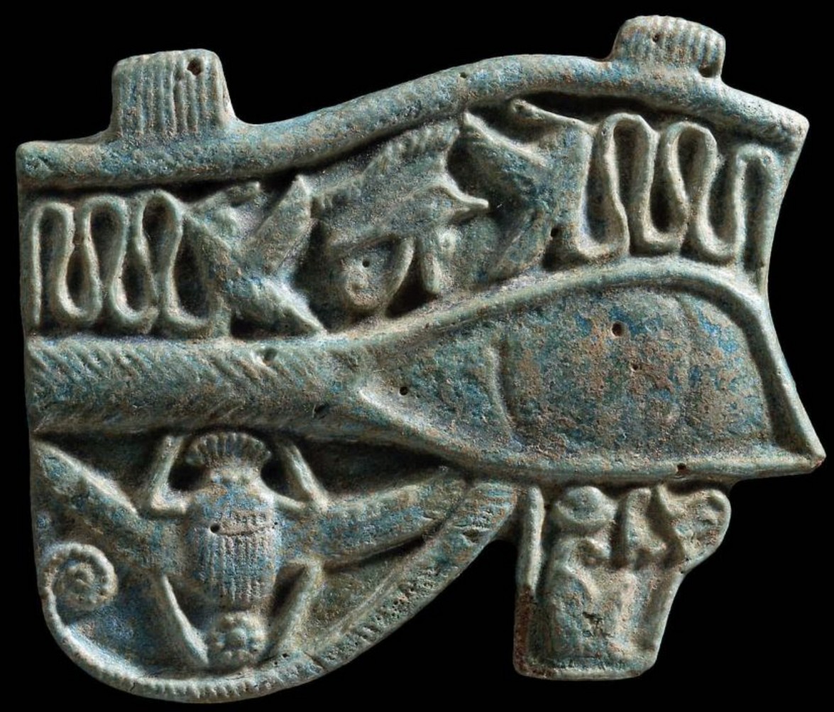 Blue glaze with a small wedjat on the top flanked by two winged serpents; Blue glaze with a small wedjat on the top flanked by two winged serpents;