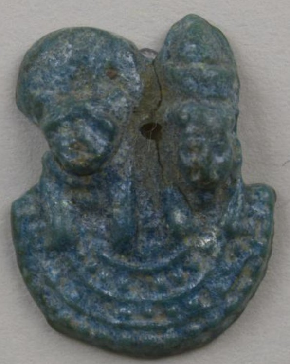 Blue glazed aegis of a cat/lioness-headed goddess (Bastet?) and of Mut flat back Blue glazed aegis of a cat/lioness-headed goddess (Bastet?) and of Mut flat back