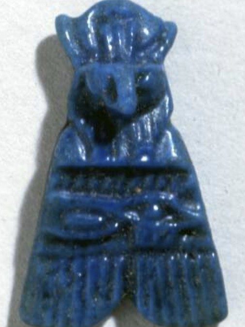 Blue glazed falcon-headed fly with a wedjat across the wings