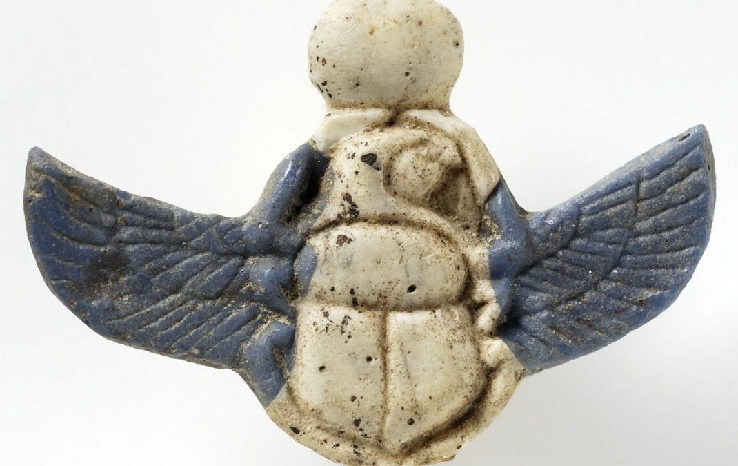 Blue and white glass inlay falcon-headed winged scarab