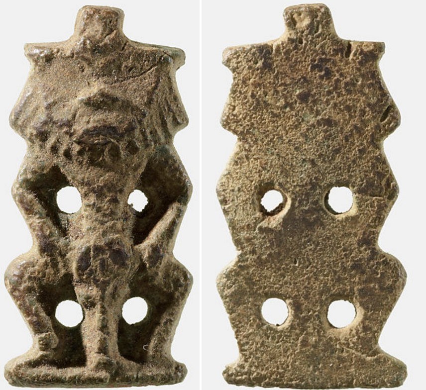 Brown glazed flat back early New Kingdom Bes Brown glazed flat back early New Kingdom Bes