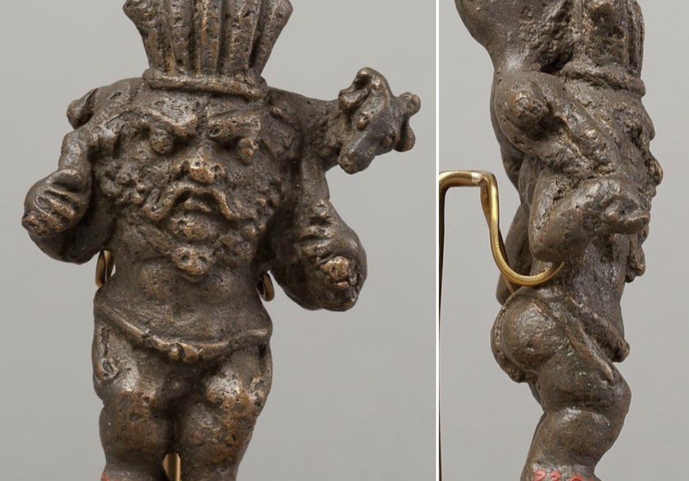 Copper alloy Bes carrying a ram over his shoulders
