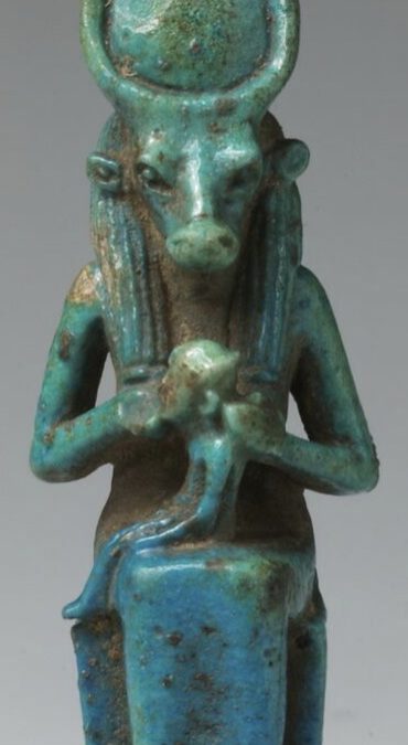 Cow-headed Hathor suckling Horus - Blue/green glazed cow-headed Hathor (named on back pillar) crowned