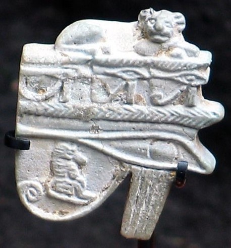 Faded pale green glaze with an identical row of three wedjats on the back Faded pale green glaze with an identical row of three wedjats on the back