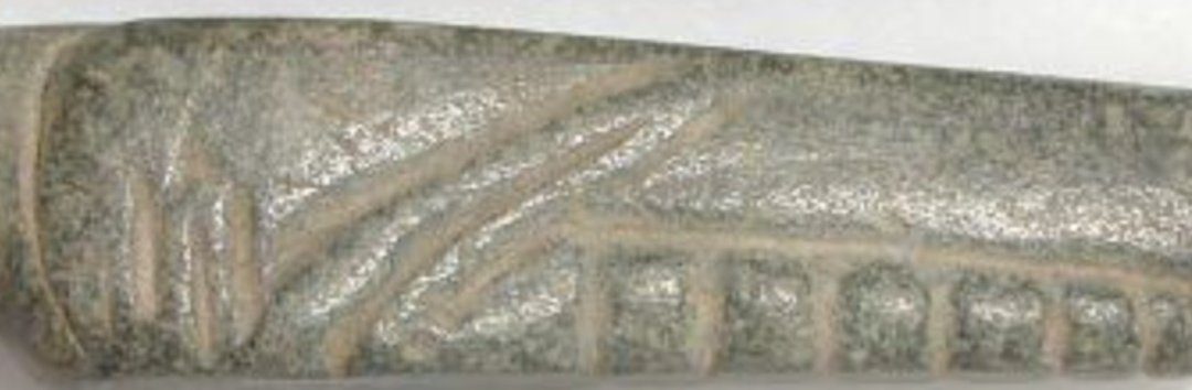 Green serpentine grasshopper amulet
