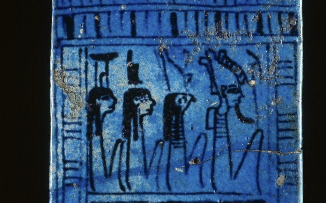Blue/black glazed naos pectoral of Nephthys, Isis, Horus and Osiris
