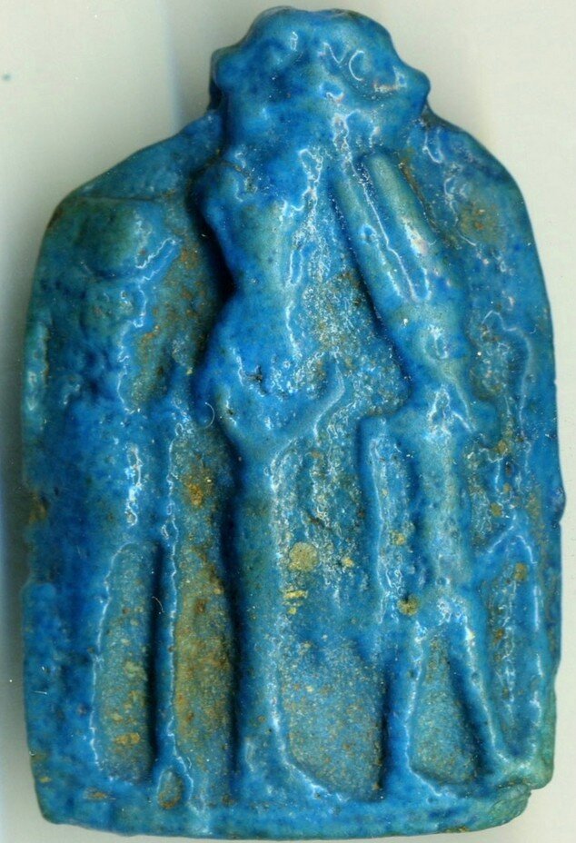 Blue glazed plaque of the Theban triad with a Bes head Blue glazed plaque of the Theban triad with a Bes head