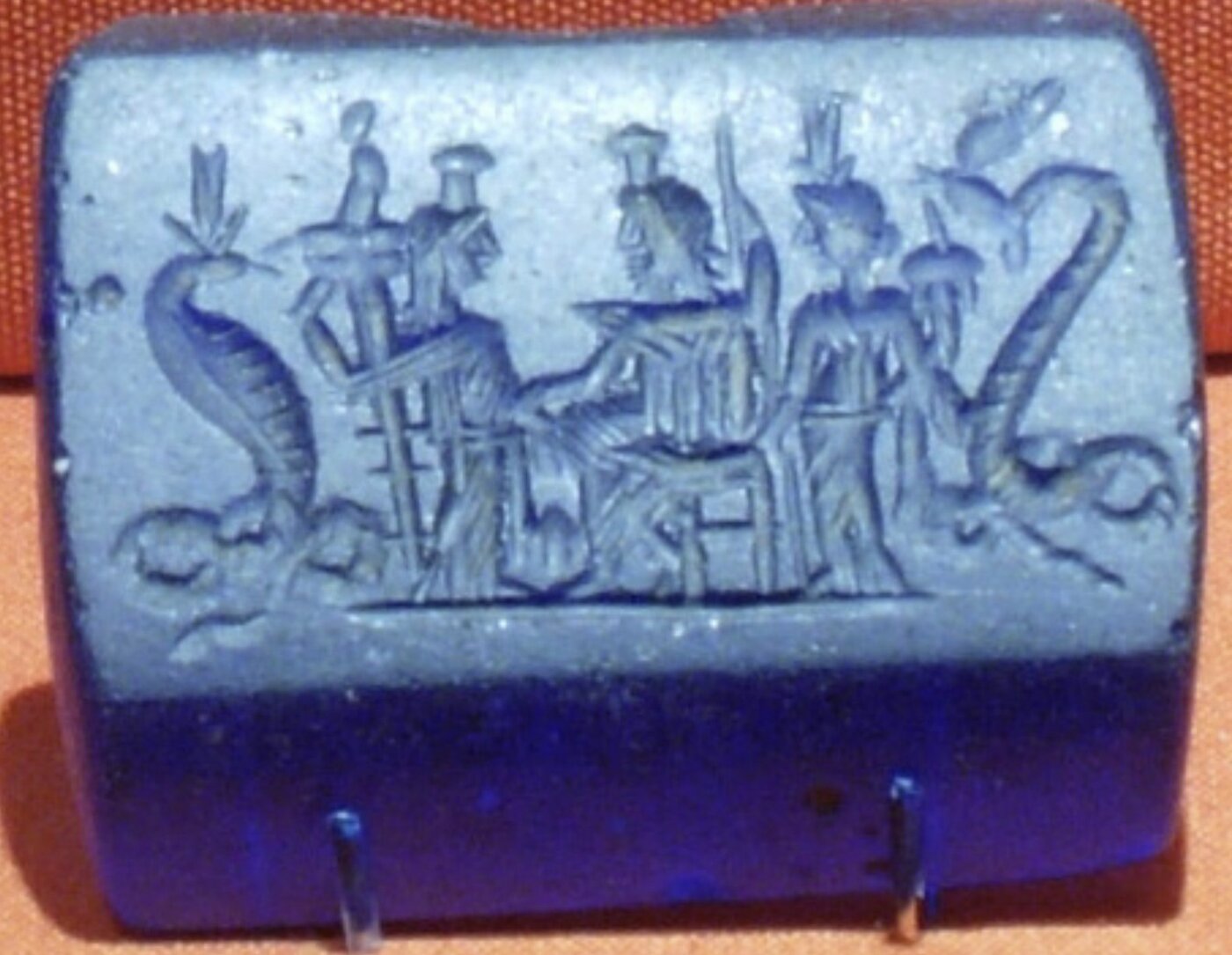 Blue glass plaque of Thermouthis, Demeter, Serapis, Isis and Agathodaimon Blue glass plaque of Thermouthis, Demeter, Serapis, Isis and Agathodaimon