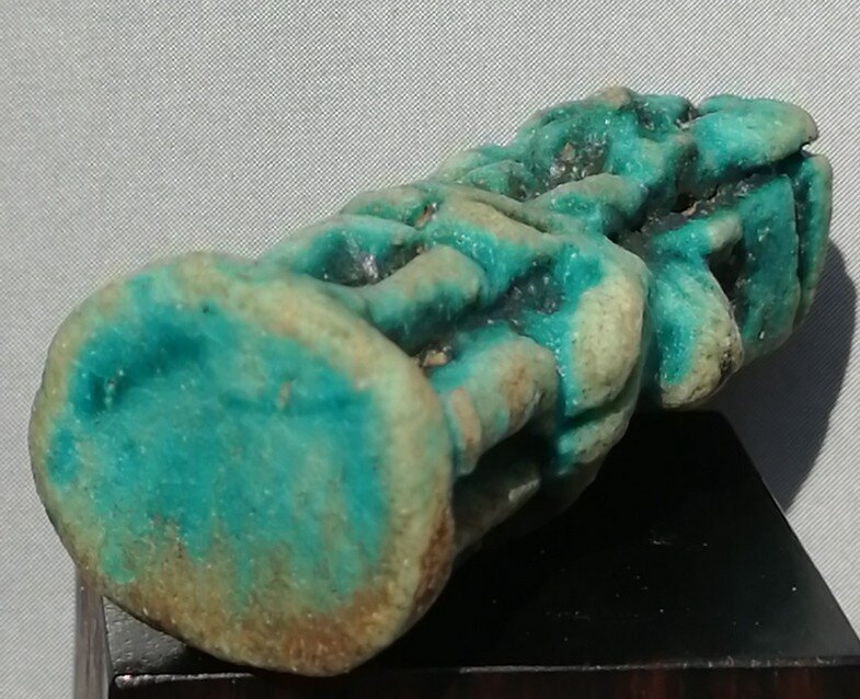 Green glazed steatite amulet of Tjenenyet and Montu, base